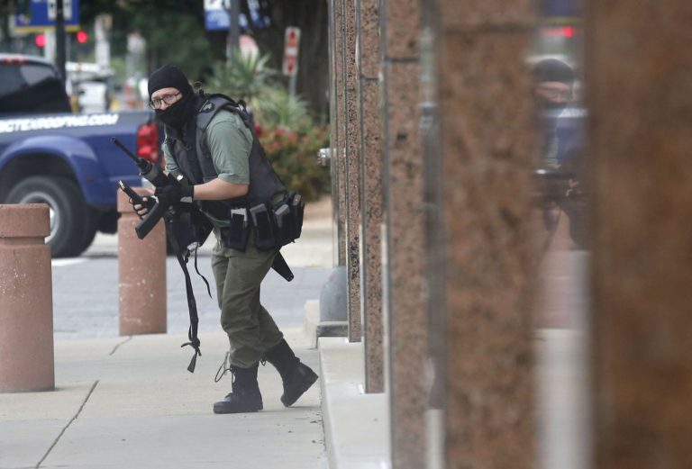 22 year old veteran Brian Issack Clyde Carrying Rifle at Dallas Federal Courthouse
